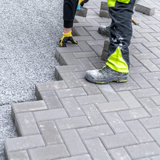 construction of a sidewalk from concrete blocks.